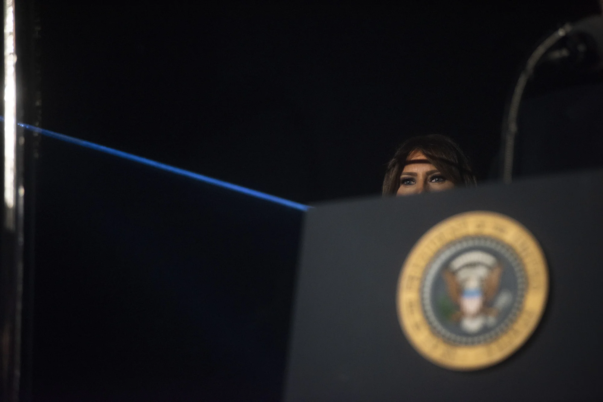 First Lady Melania Trump stands behind the presidential podium as President Donald Trump speaks during his first National Christmas Tree Lighting in Washington, D.C. on November 30, 2017. 