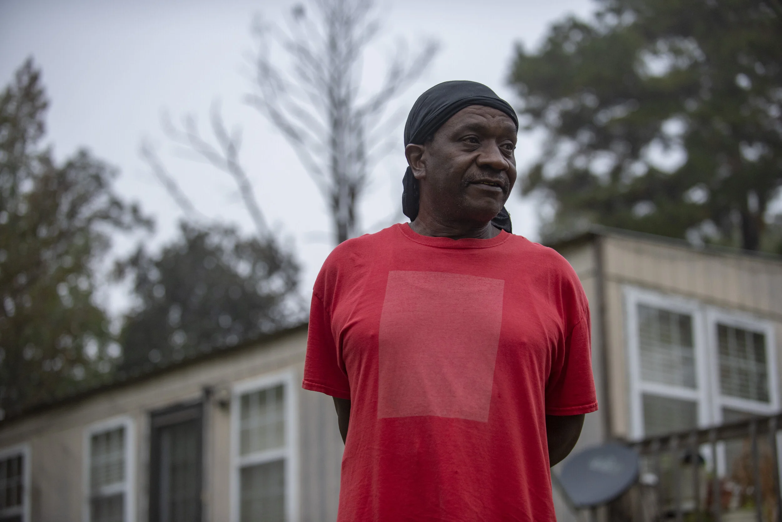  Ronell Martin poses for a portrait at his home in Warm Springs, Ga. on Oct. 27, 2020. Martin has a Trump sign in his yard, but his girlfriend’s and he said he will vote for Biden on Nov. 3. 
