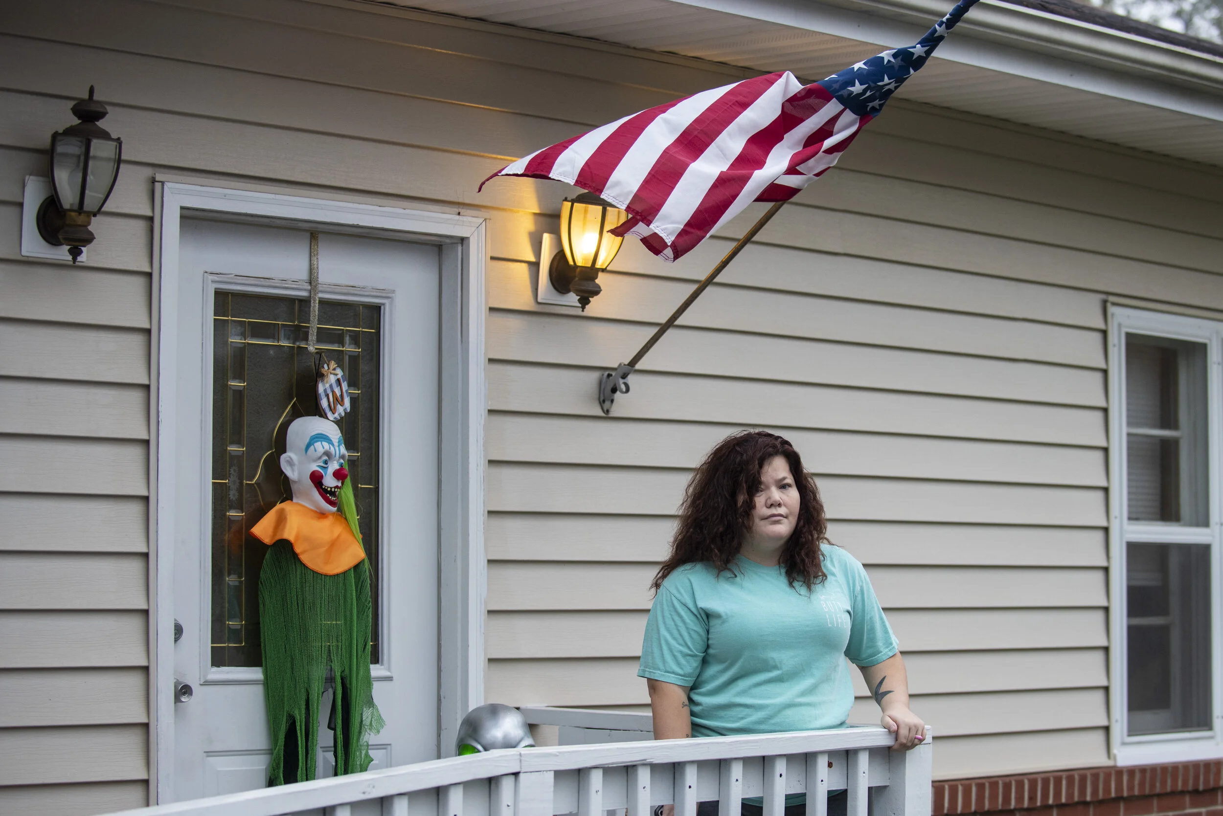  Julia Whitmore poses for a portrait at her home in Warm Springs, Ga. on Oct. 27, 2020. She has a 20-foot sign in her yard that spells BLACK LIVES MATTER, flanked by a Biden sign. Next to it? A Trump sign placed by her mother who lives in the RV next