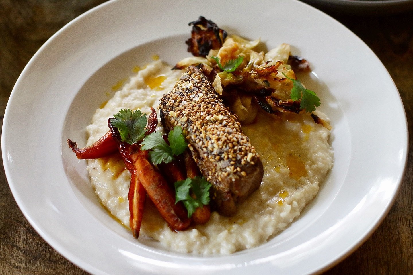 Beef Short Rib 🤭 Deboned, seared, and braised, then topped with Mexican everything spice. Served with Carolina Gold rice grits finished with guajillo oil, poached carrots, and fried cabbage. 

Try it tonight when 20% of sales go towards Athens Commu