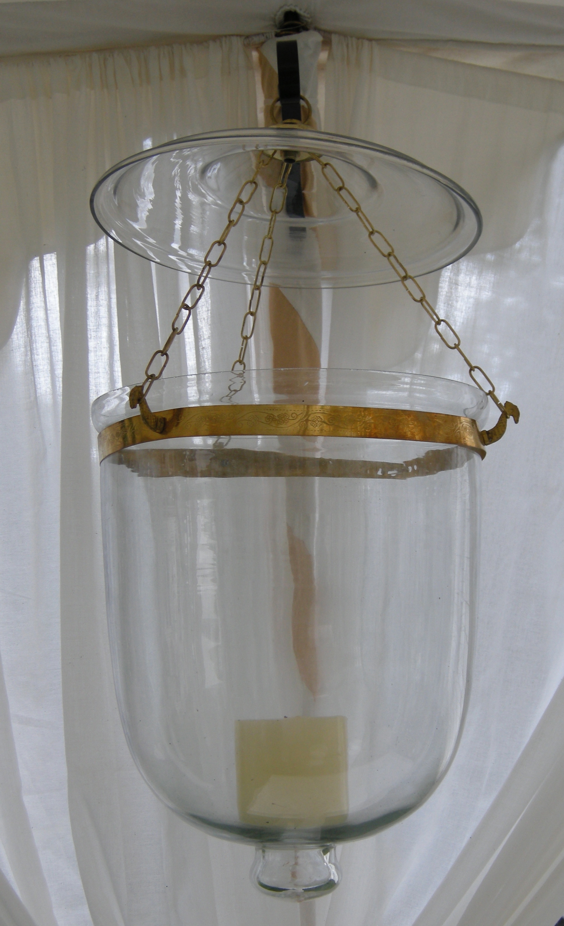 Clear bucket lantern, not fitted for electricity. Approximately 18" high; 10" diameter