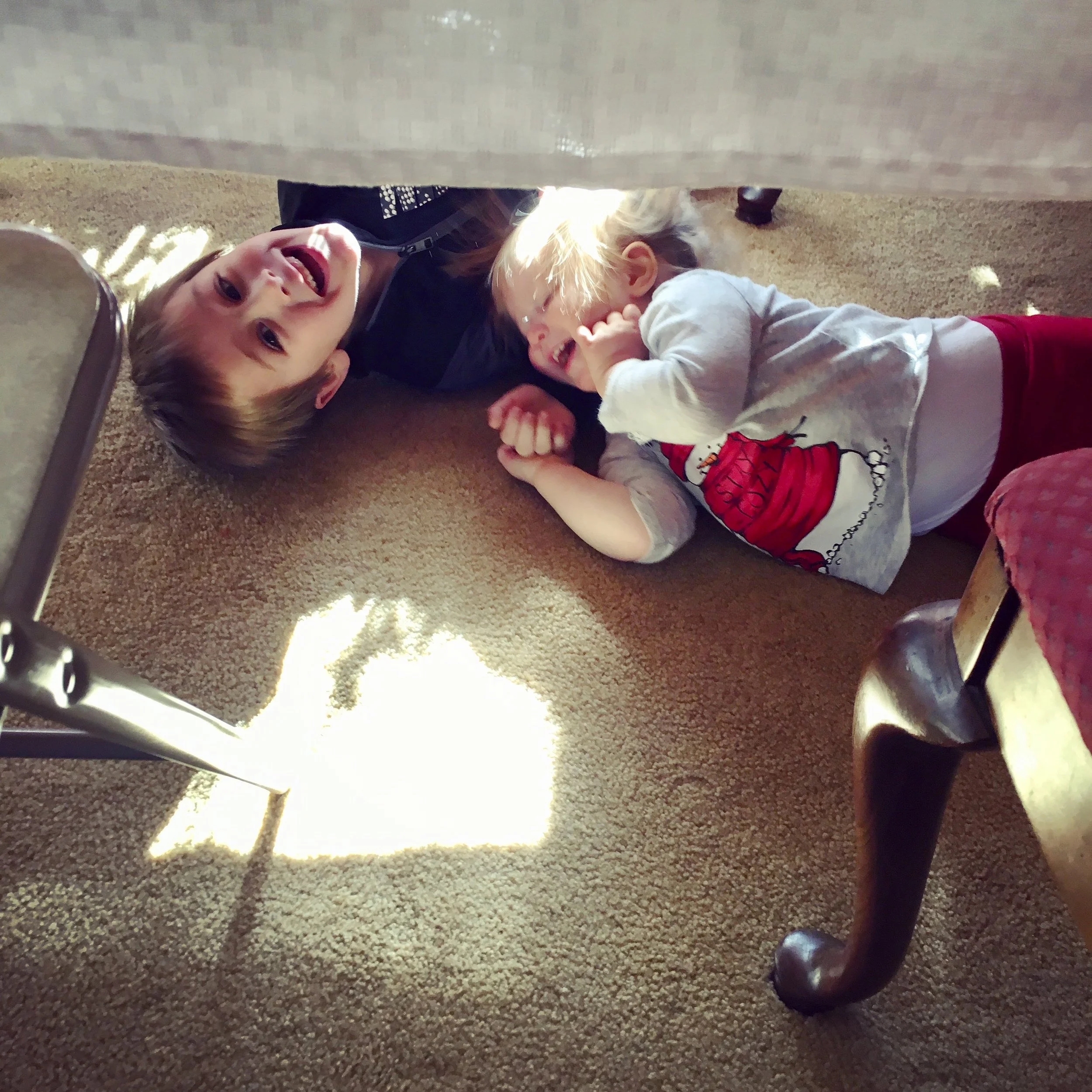 Under the table > At the table