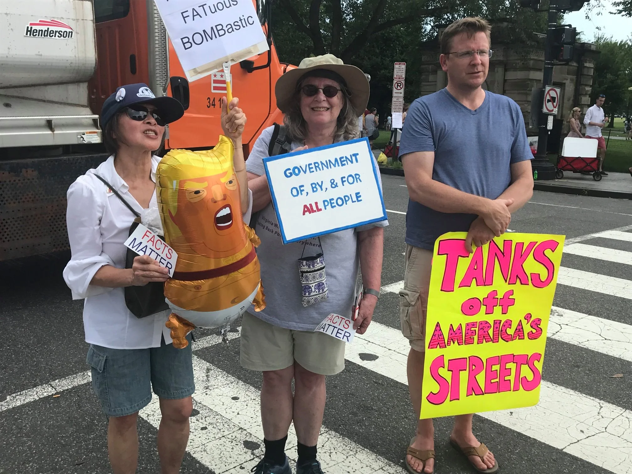 NOPEsters and friend protesting Trump’s presence at July 4 festivities.