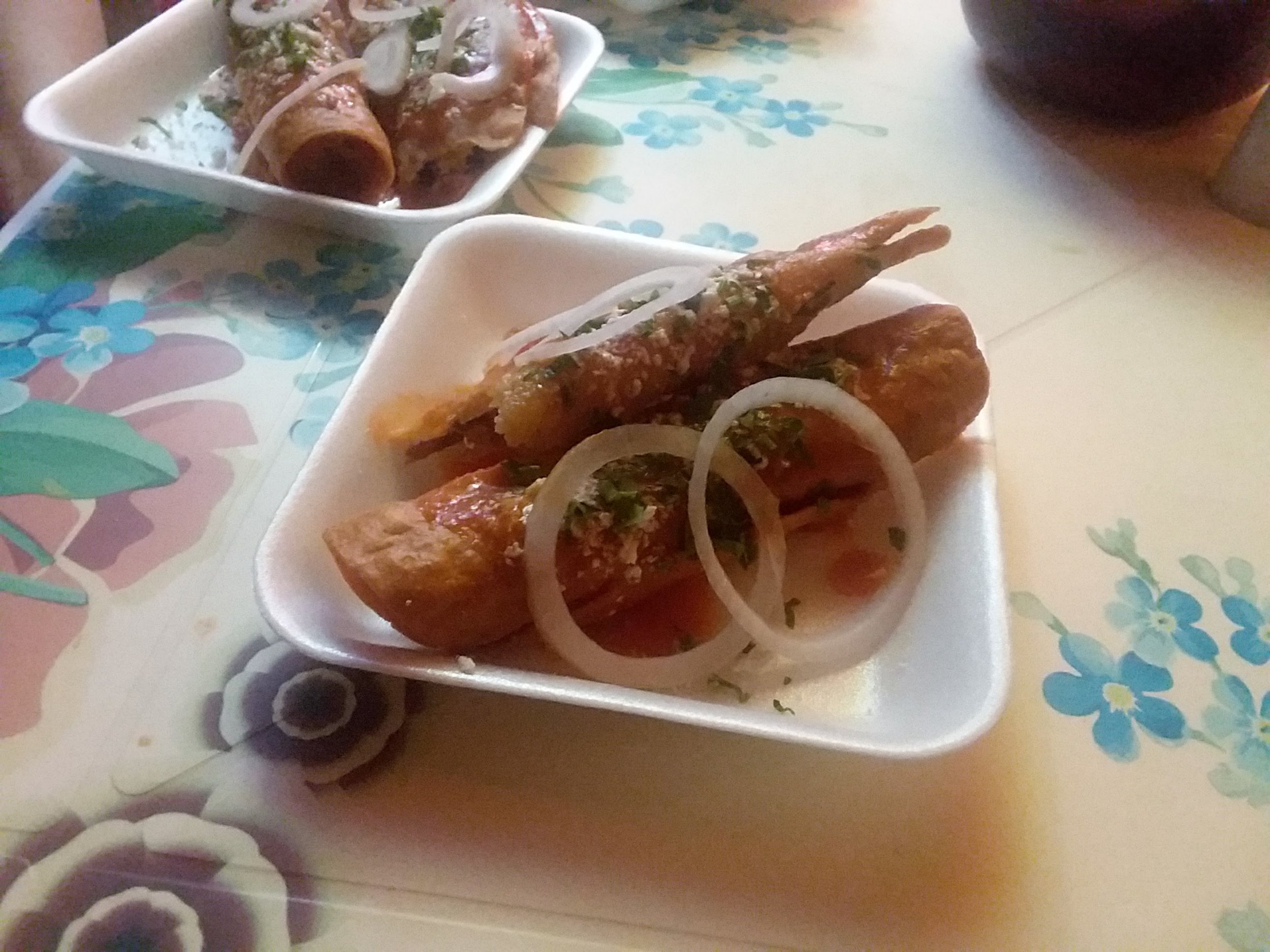 Just one of the many delicious meals we've had. This is a doblada (on top), and a taco, both filled with meat and veggies, fried, and topped with a simple salsa, cheese, parsley and onion slices.