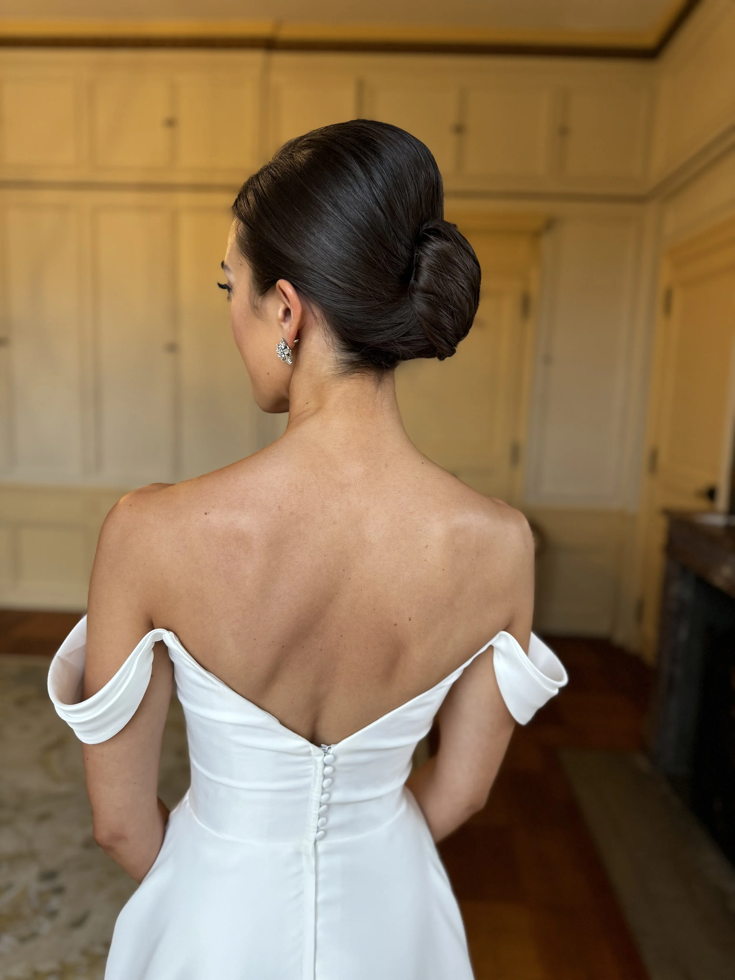 luxury wedding hair low updo view from the back.jpeg