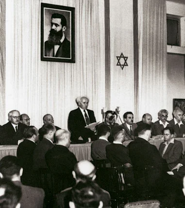 Minutes before the British Empire relinquished its hold on the area of Palestine David Ben-Gurion, the future prime Minister of Israel announced the formation of the state in the Tel Aviv Museum of Art on Rothschild Street. The date was May 14, 1948, (5 lyar of the Hebrew calendar) Tel Aviv, Israel. Photograph by Rudi Weissenstein https://upload.wikimedia.org/wikipedia/commons/b/b8/Declaration_of_State_of_Israel_1948_2.jpg