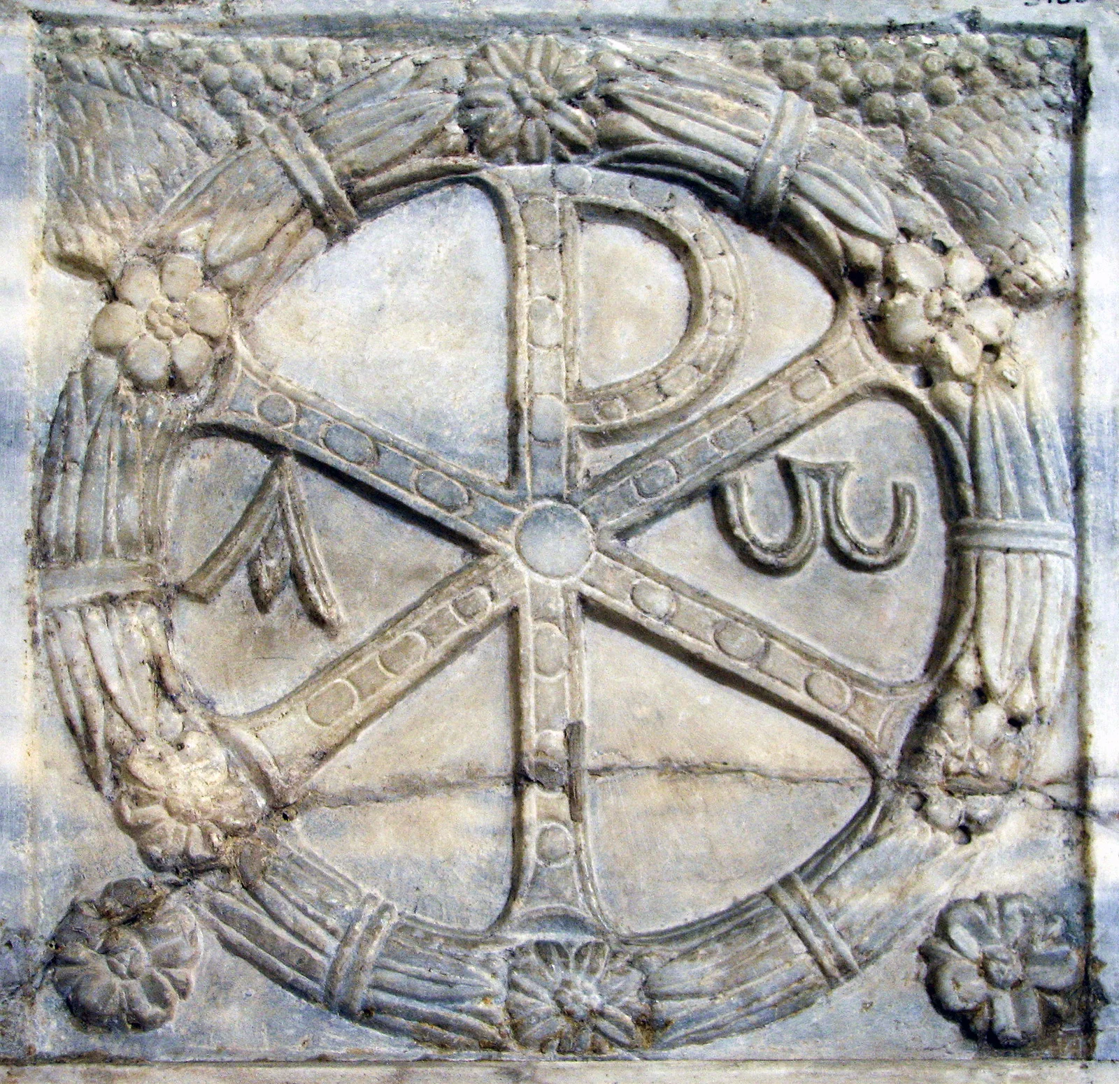 According to legend Constantine had positioned his army opposite the army of Maxentius. The night before the battle Constantine had a vision in which he was told to place the sign of God on the shields of his men and his army would be led to victory. The next more Constatine had the ChiRho placed on the shield of his men and with the start of the battle the fight quickly became a rout. Maxentius was drowned while trying to cross the Tiber River in his escape back to Rome. The Kerch Missorium shows Constantine's son Constantius II, accompanied by a guardsman with the Chi Rho monogram depicted on his shield. Photograph is taken from Ludwig von Sybel, Christliche Antike , vol. 2, Marburg, 1909