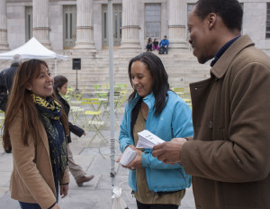 Directors of Full Force, Anginese Phillips & Kadeem Alston-Roman engaging with a member of the Brooklyn community at Brooklyn Borough Hall.
