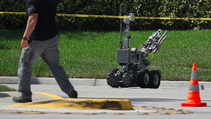 The Broward Sheriff's Office bomb squad deploys a robotic vehicle to investigate a suspicious package in the building where Rep. Debbie Wasserman Schultz (D-FL) has an offce on October 24, 2018 in Sunrise, Florida. - Via Khou