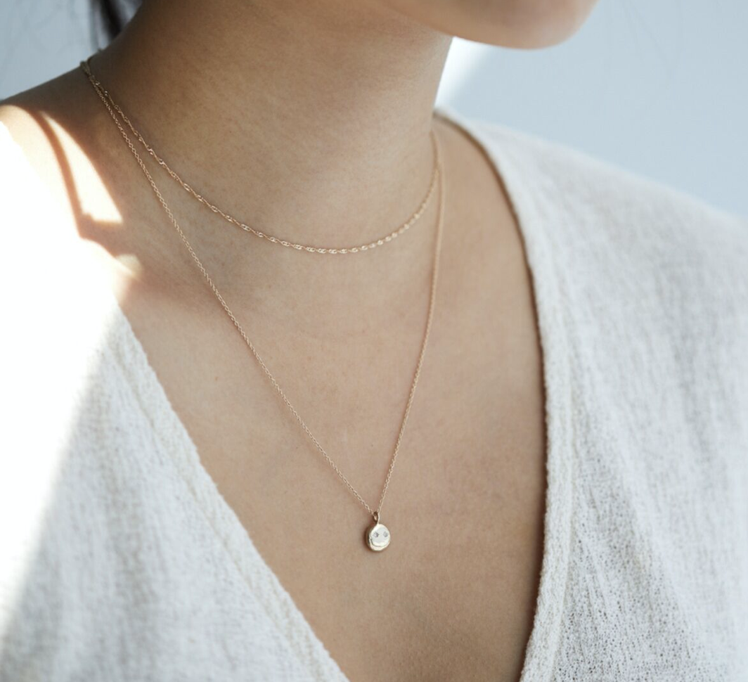SMILEY FACE NECKLACE, $394