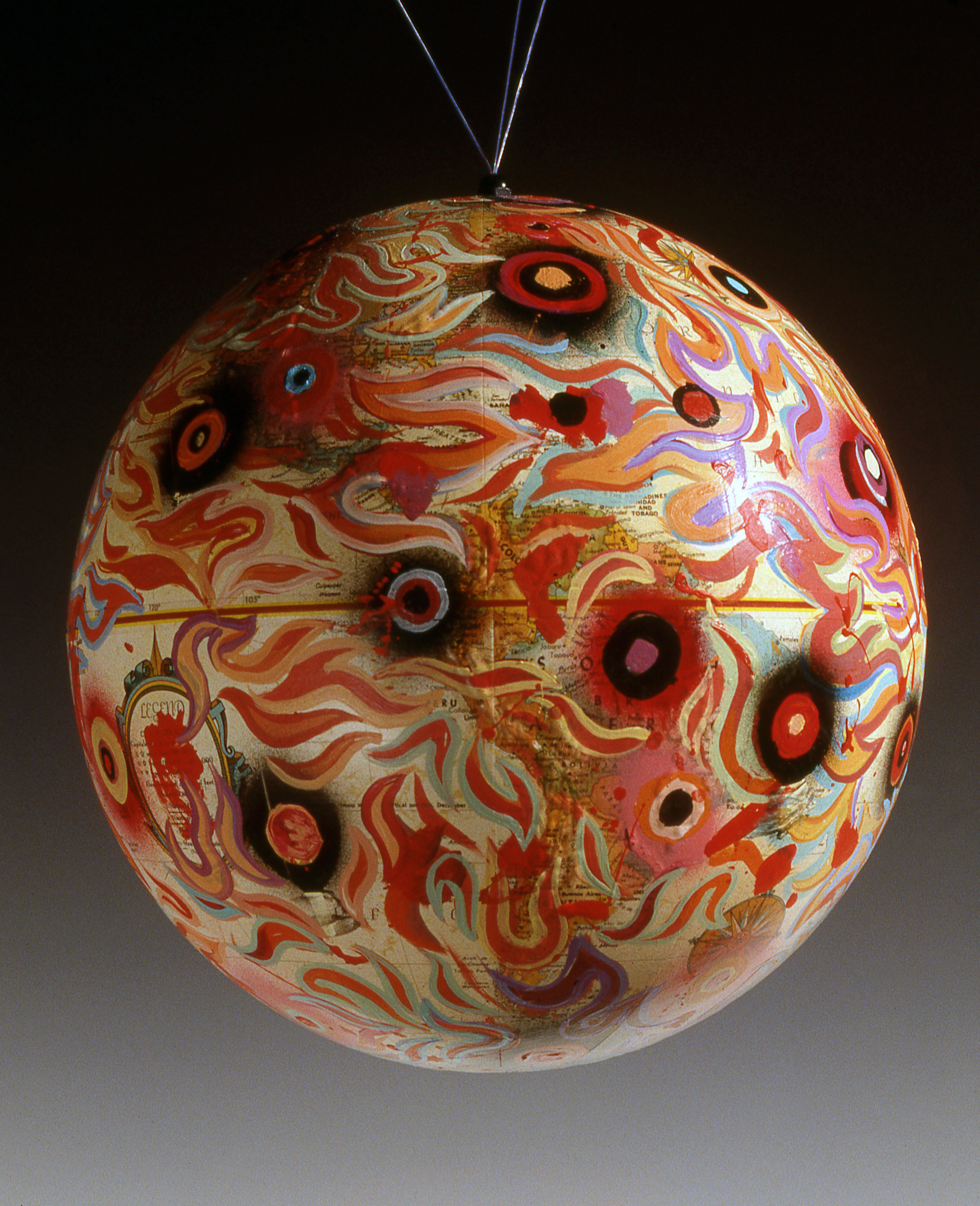 Holes , 1992 Cel vinyl on found paper globe, 9" diameter
