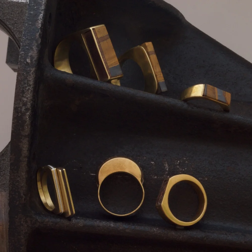 BRASS COLLECTION WITH WALNUT INLAYS AND TIGER'S EYE