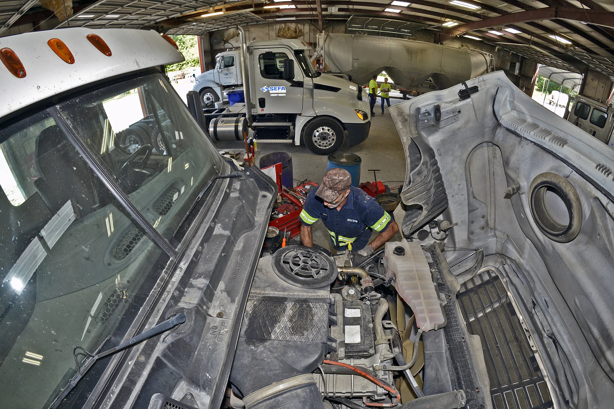 Technician works on engine.jpg