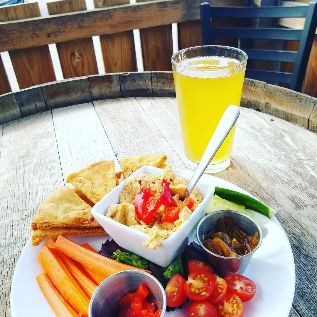 Come cool down with an ice cold Hop Pop &amp; our new Hummus Plate! 🥵🍺🍽️🍺😎Our 100% Maine-grown Berliner Weisse is a light, crisp sour ale brewed w/ local honey &amp; pairs great with our 100% plant-based house roasted garlic hummus, served w/ fr