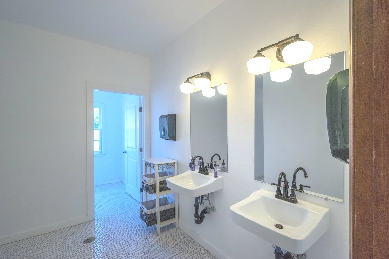 Main Floor Restroom Vanity Area with 4 Individual Bathrooms