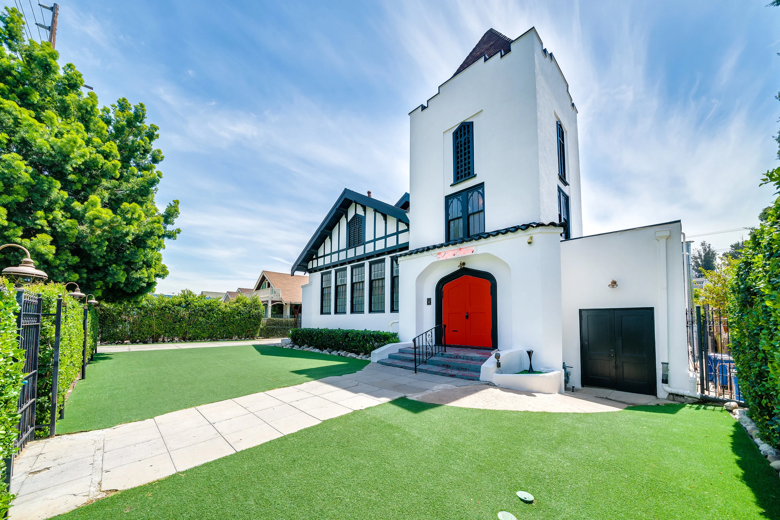 The York Manor Main Entrance With Red Doors From York Blvd