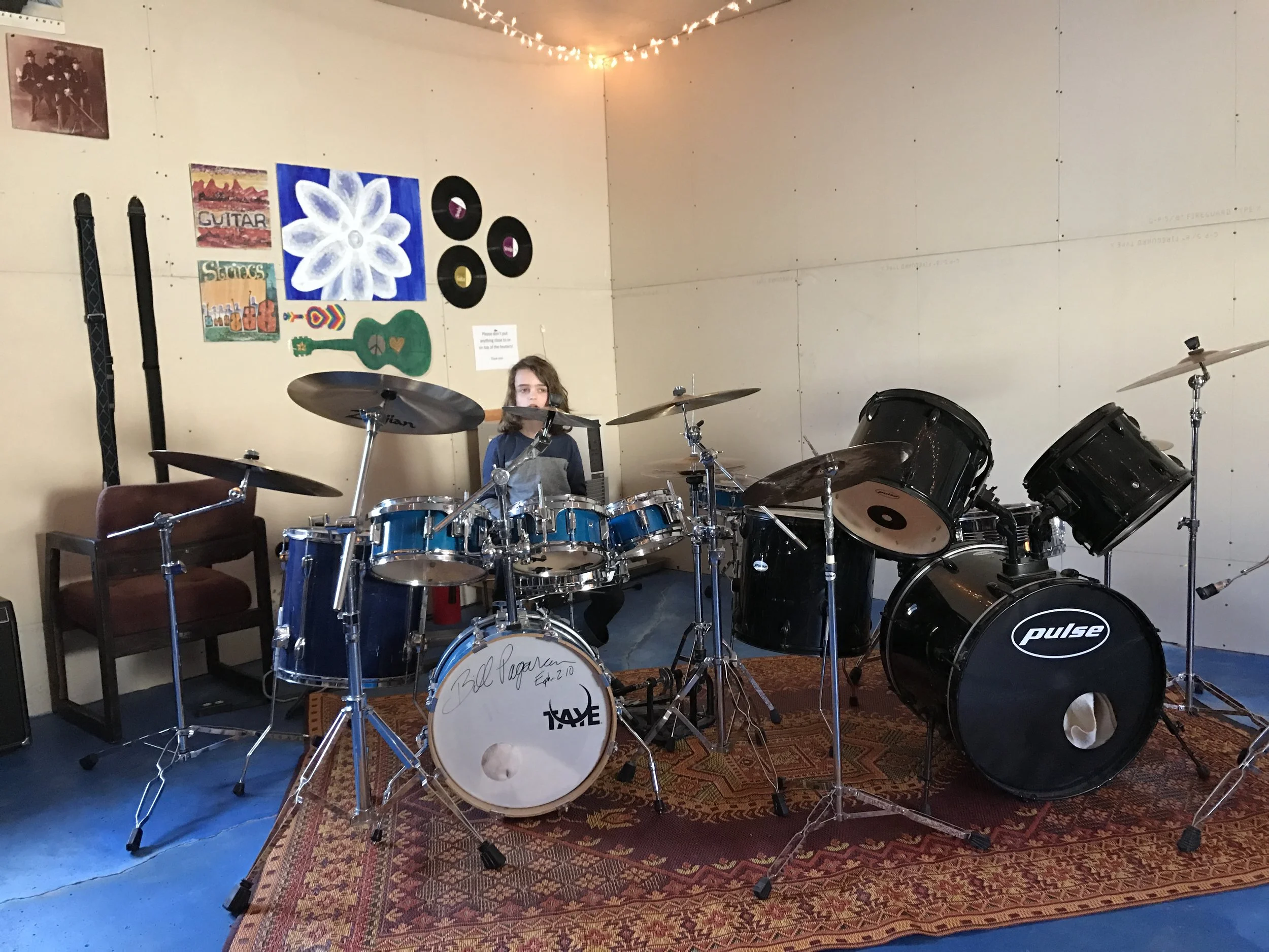 Otis tests the drums on the loud rock side of the music shack