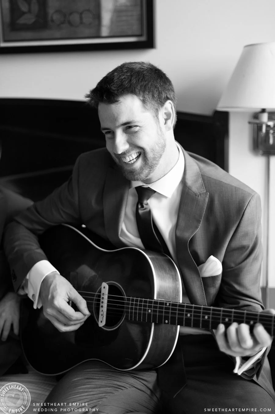 The groom jamming with his bandmates on the wedding day.
