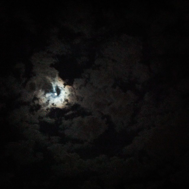 Full Moon behind clouds