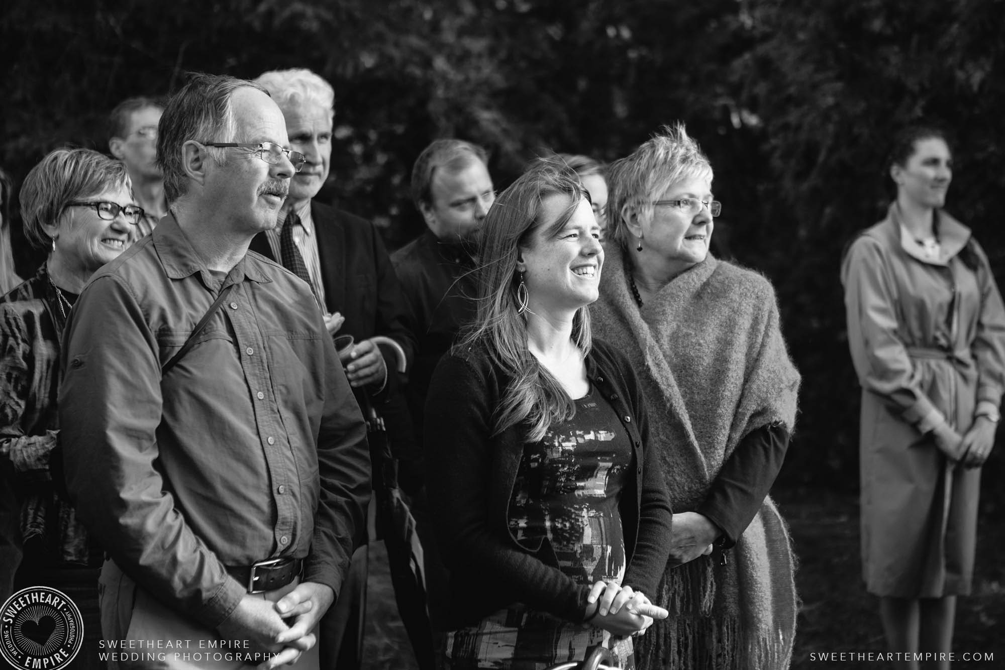 Happy guests smiling at an unplugged wedding. 