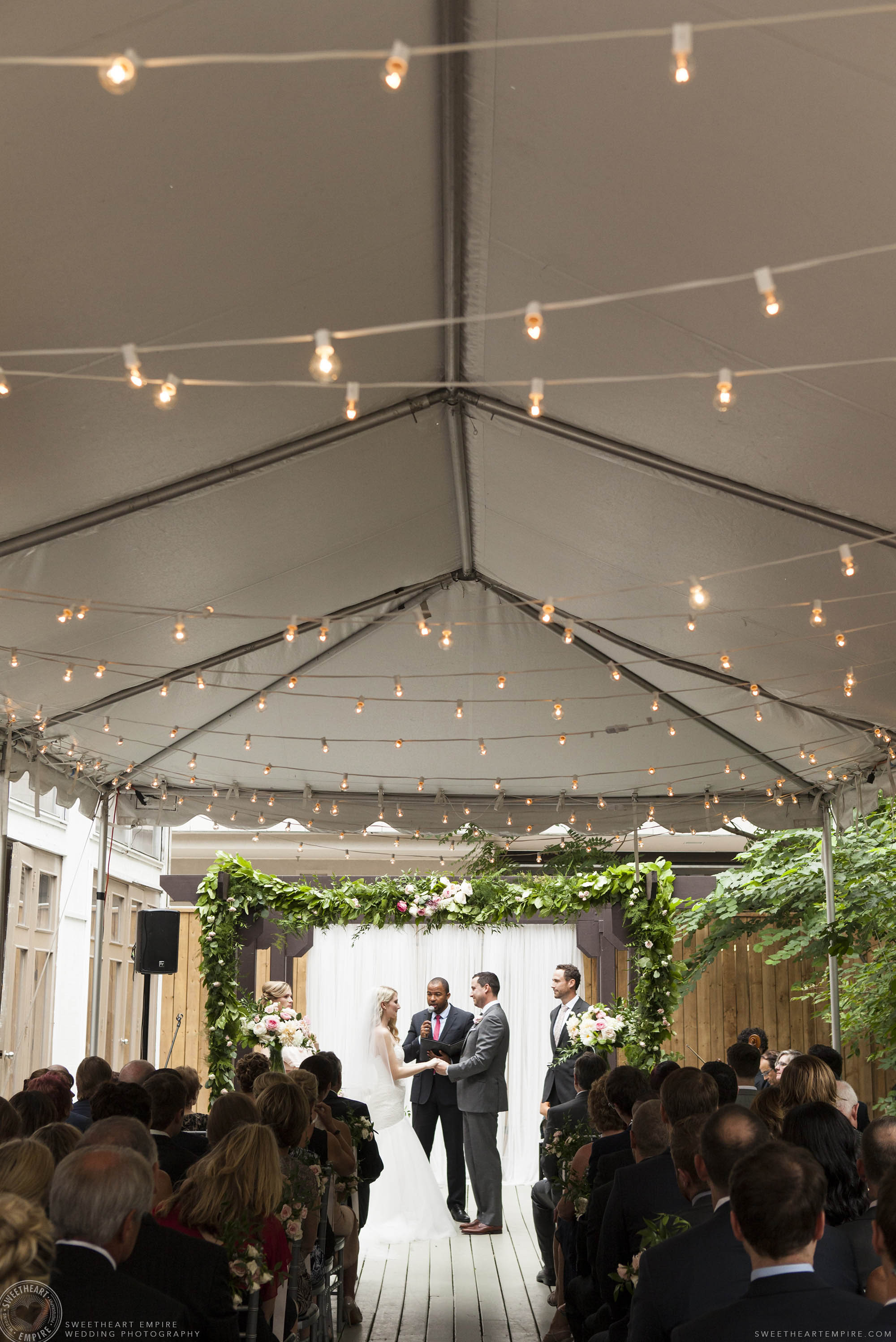 Bride and groom saying their vows at Berkeley Fieldhouse.