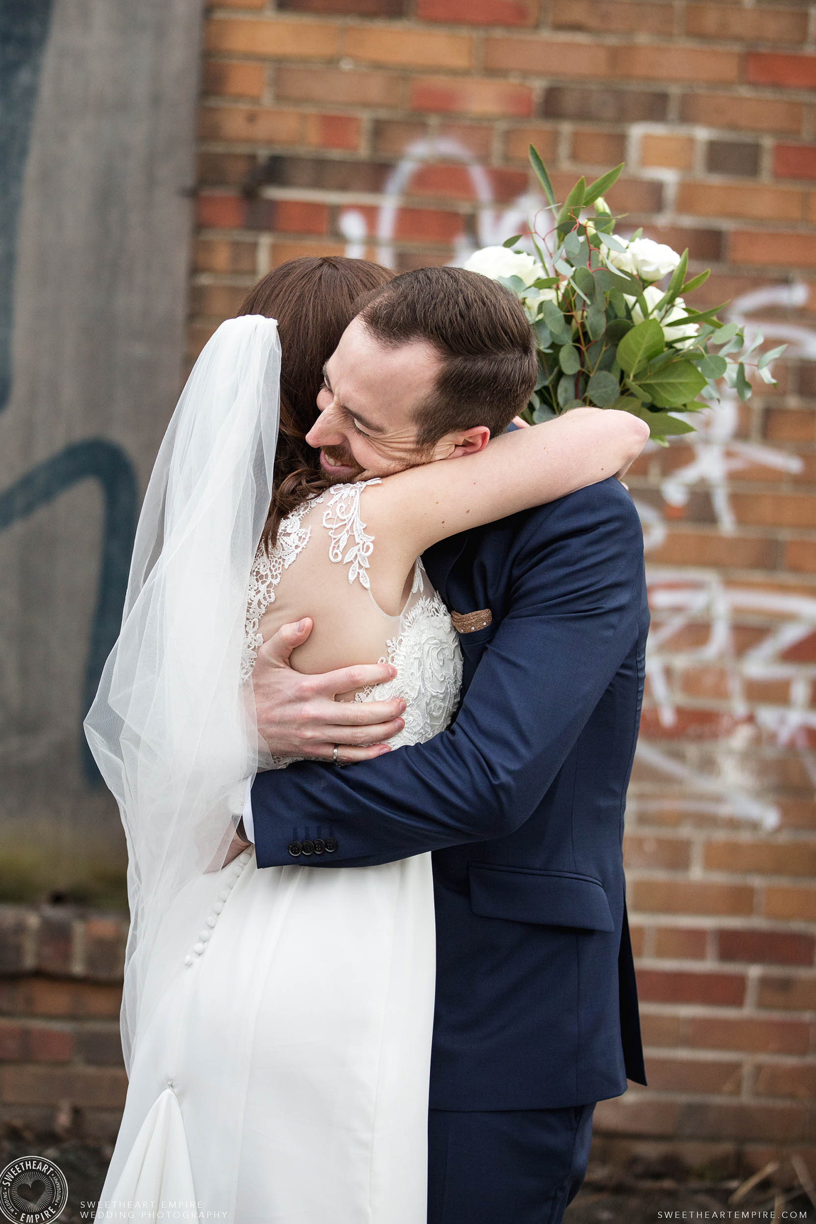 Groom hugs bride after their reveal at District 28 Wedding, Toronto. 