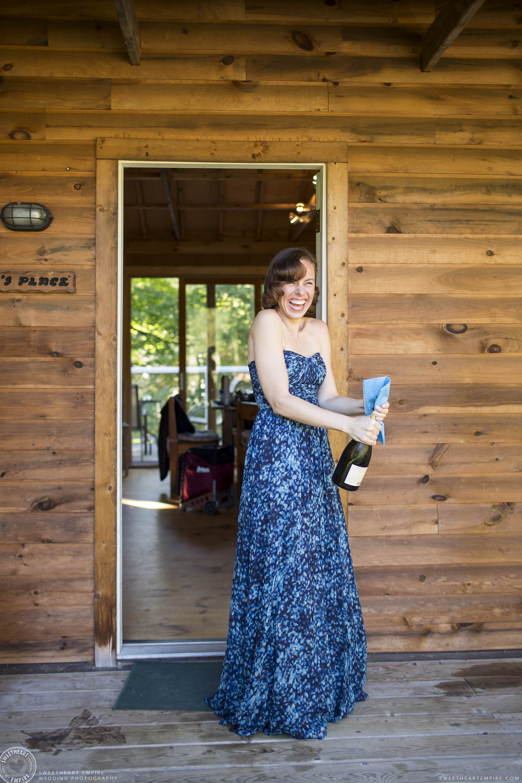 Camp Manitou Bridesmaid popping champagne