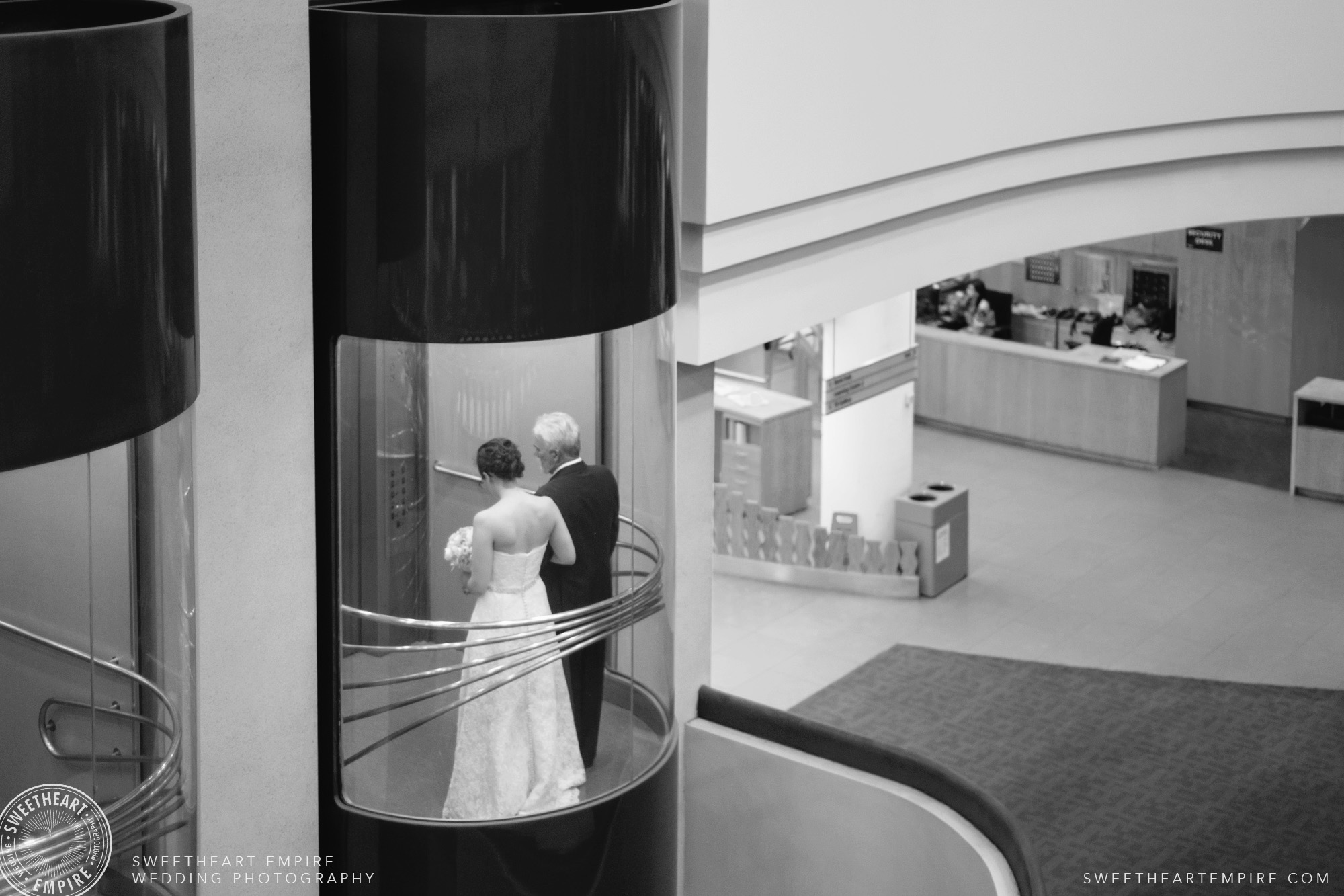 Bride and her father taking the elevator up to the ceremony; Toronto Reference Library Wedding