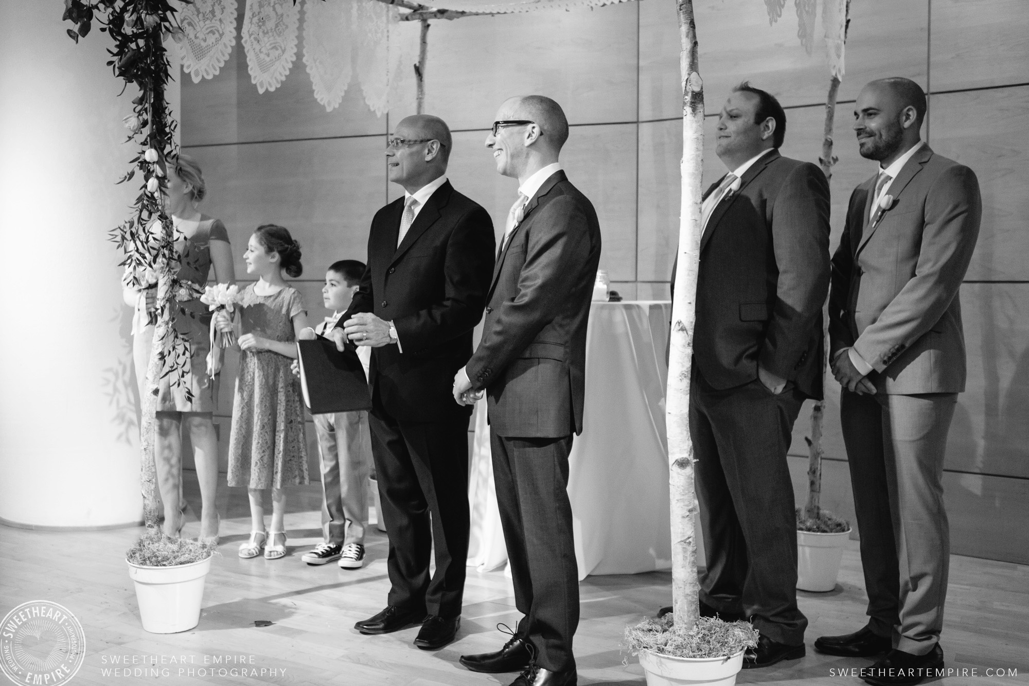 The groom is waiting for his bride to begin the ceremony; Toronto Reference Library Wedding