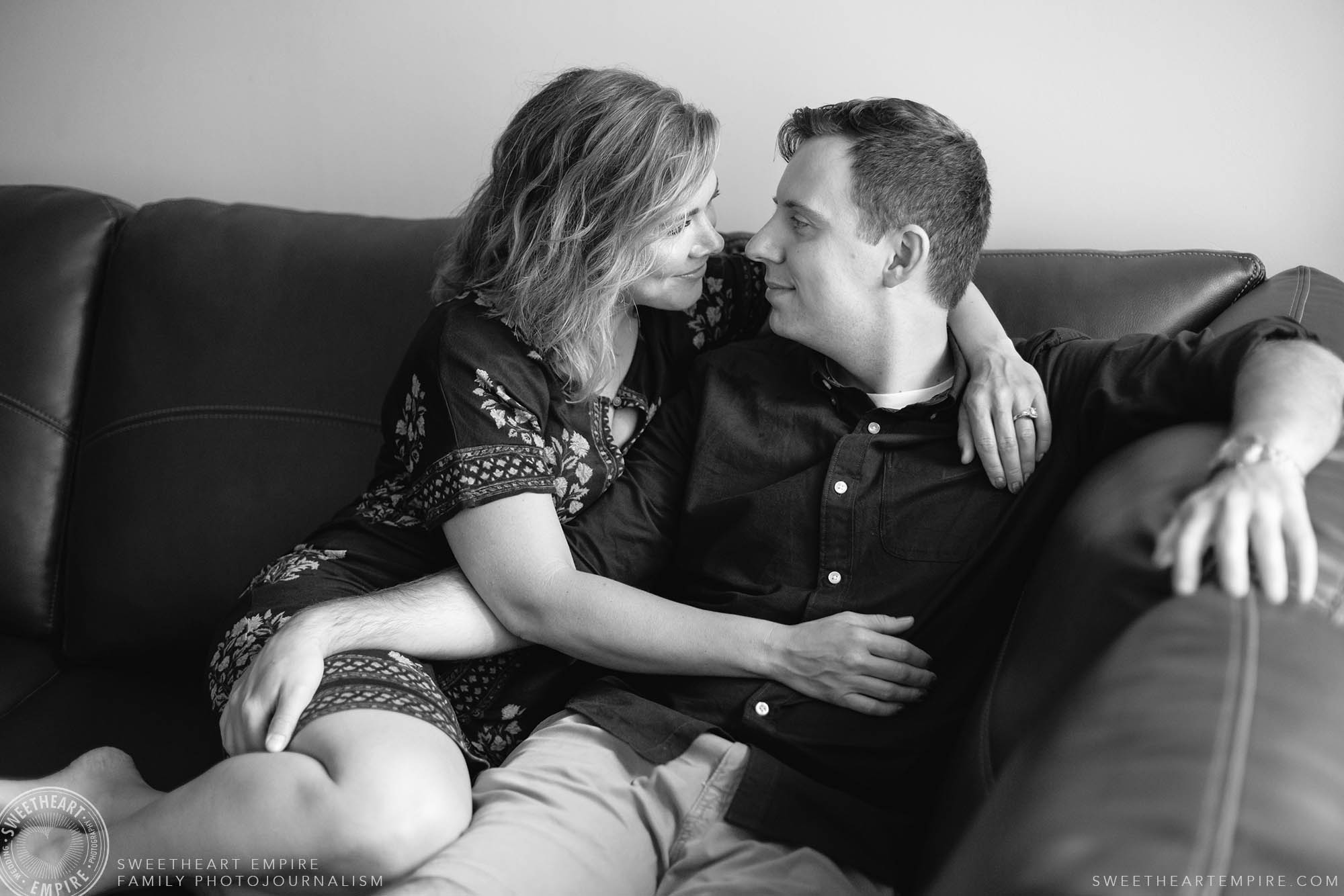 17_Wife and husband chatting and embracing on couch.jpg