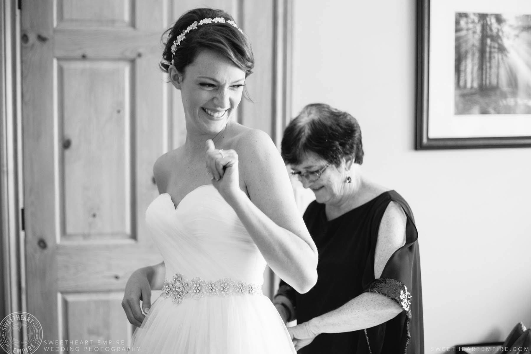 Bride gets emotional while her mom does up her wedding dress at this Rockway Vineyards wedding in Niagara.