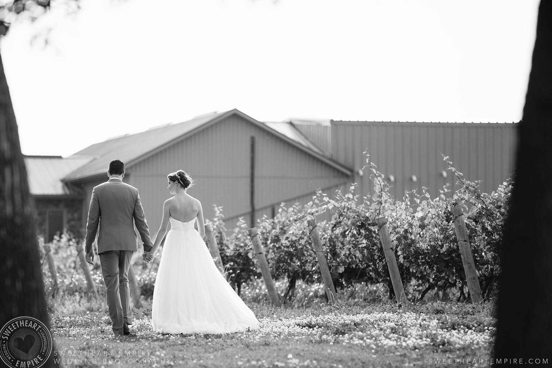 Bride and groom walking through the vineyards, Rockway Vineyard Wedding, Niagara