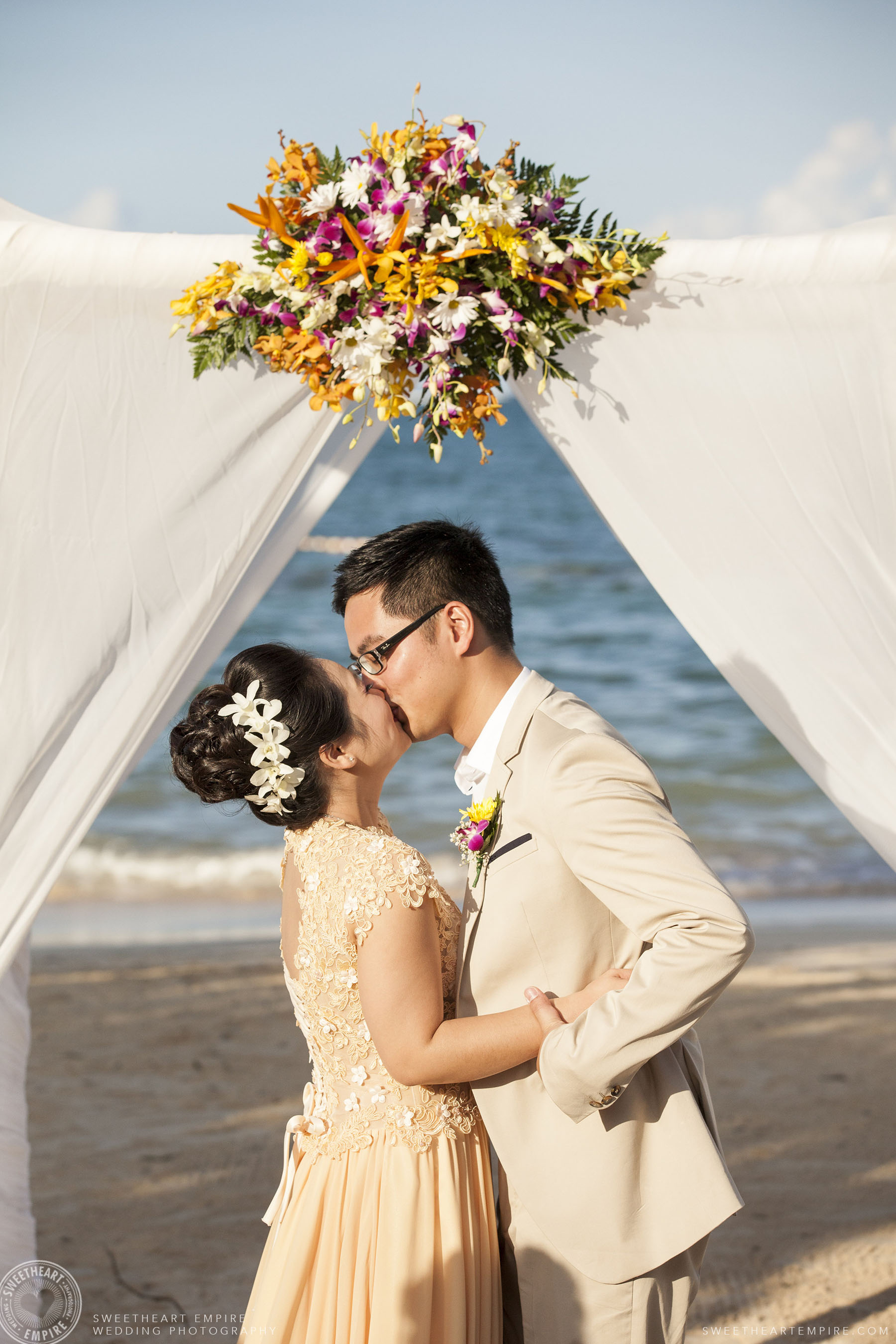 Bride and groom kiss during wedding ceremony; Iberostar Grand Hotel Rose Hall, in Montego Bay, Jamaica