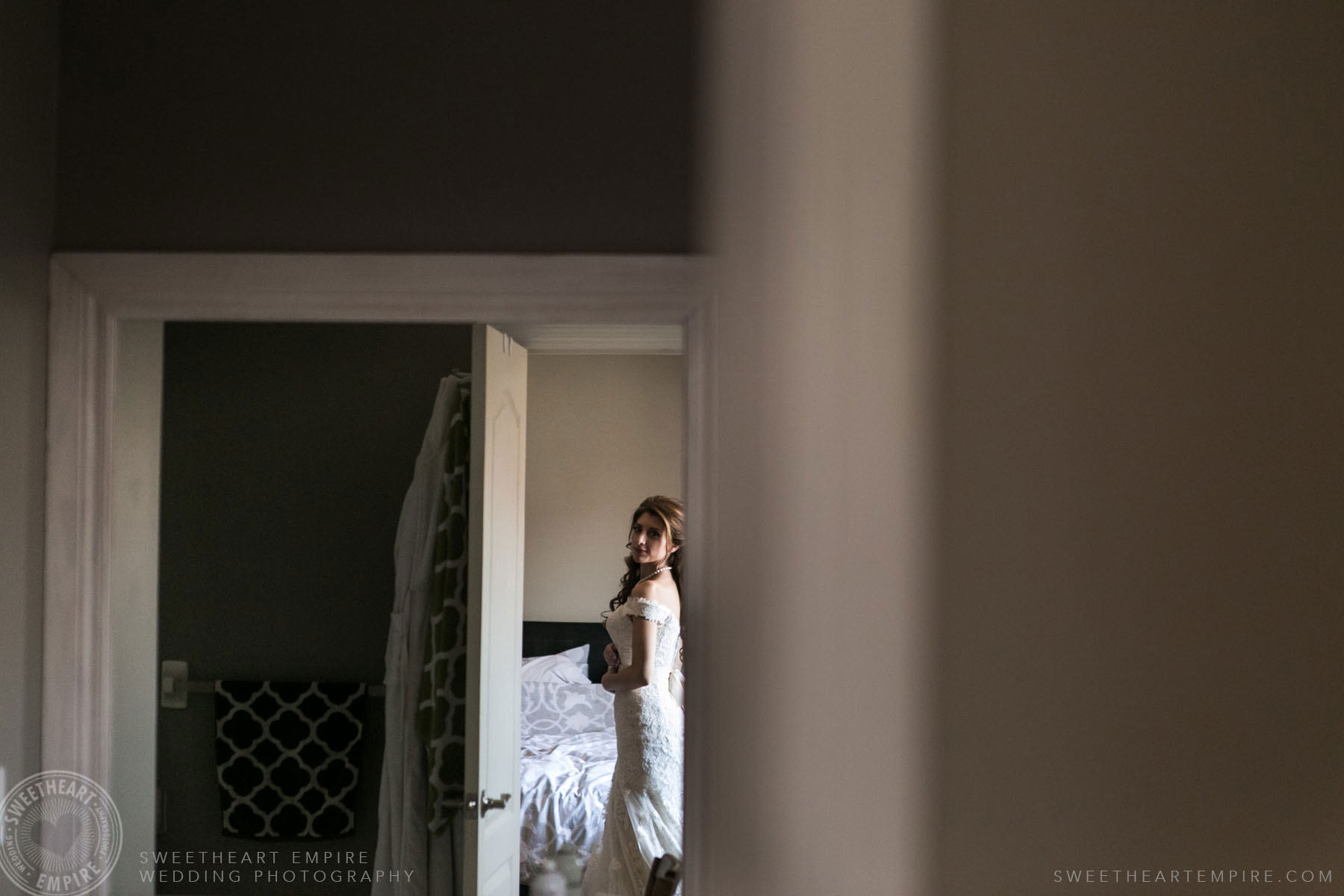 Bride looking at herself in the mirror; Eagles Nest Golf Club Wedding Photos