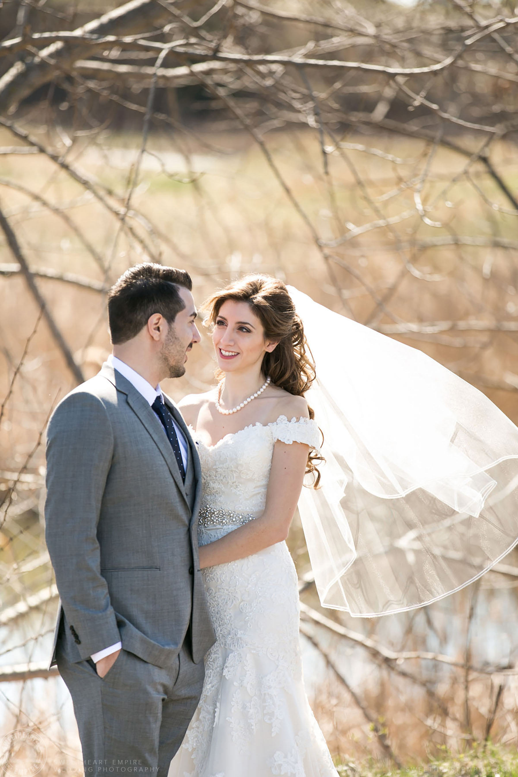 Bride's veil blowing in the wind; Eagles Nest Golf Club Wedding Photos