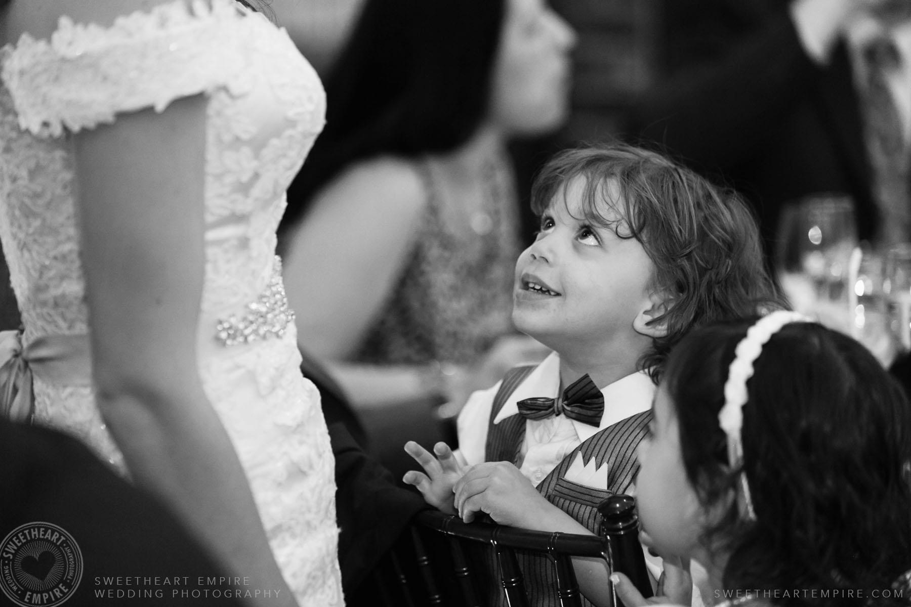 Little boy looking at bride; Eagles Nest Golf Club Wedding