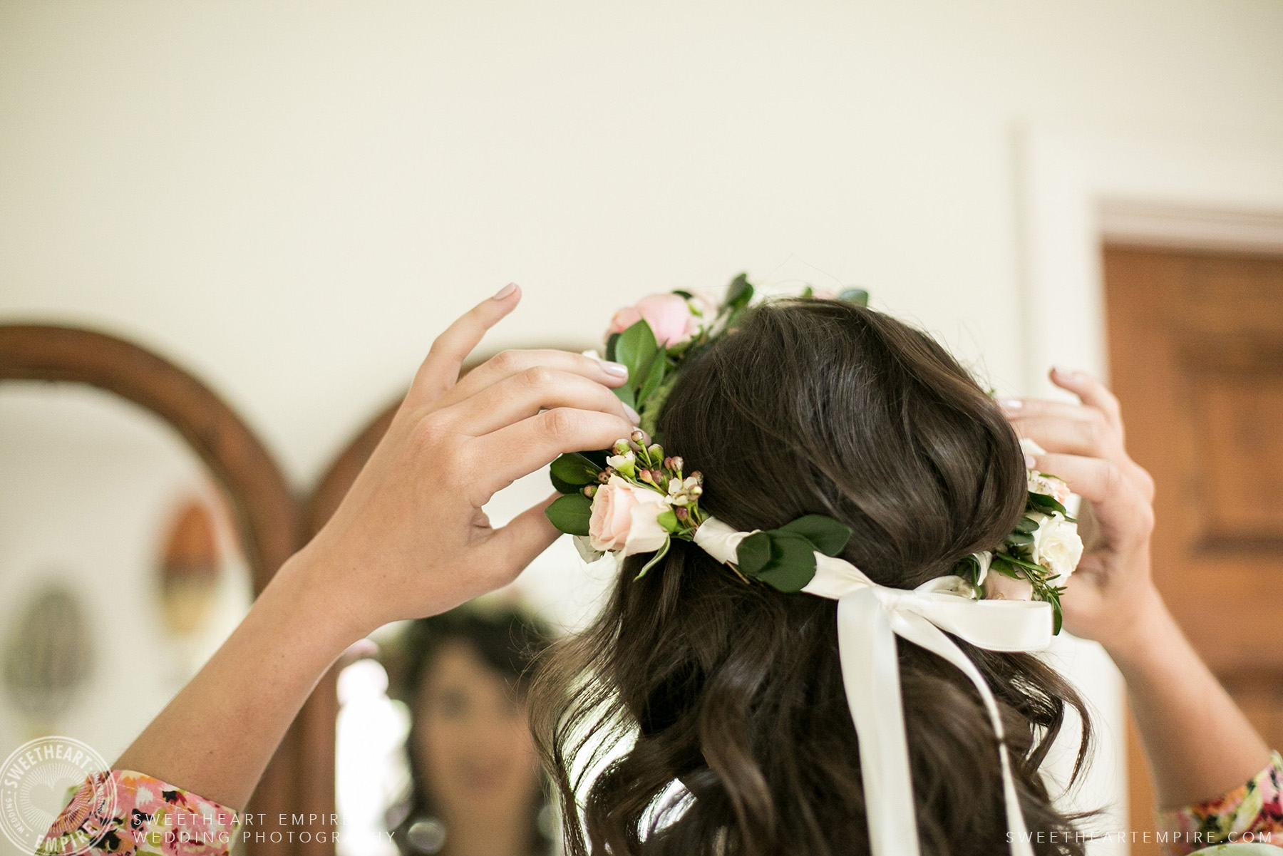 Bride adjusting her floral crown, Toronto Island Elopement