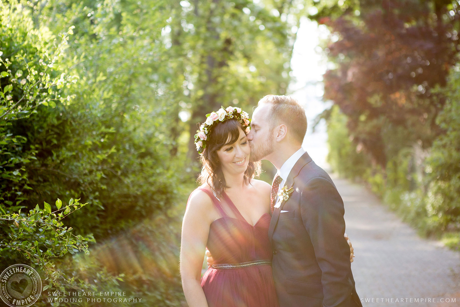 Groom kissing his new bride, Toronto Island Elopement