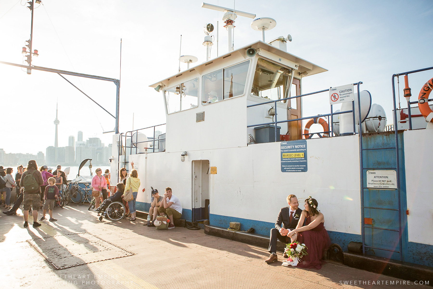 Bride and groom waiting for the ferry to depart, Toronto Island Elopement