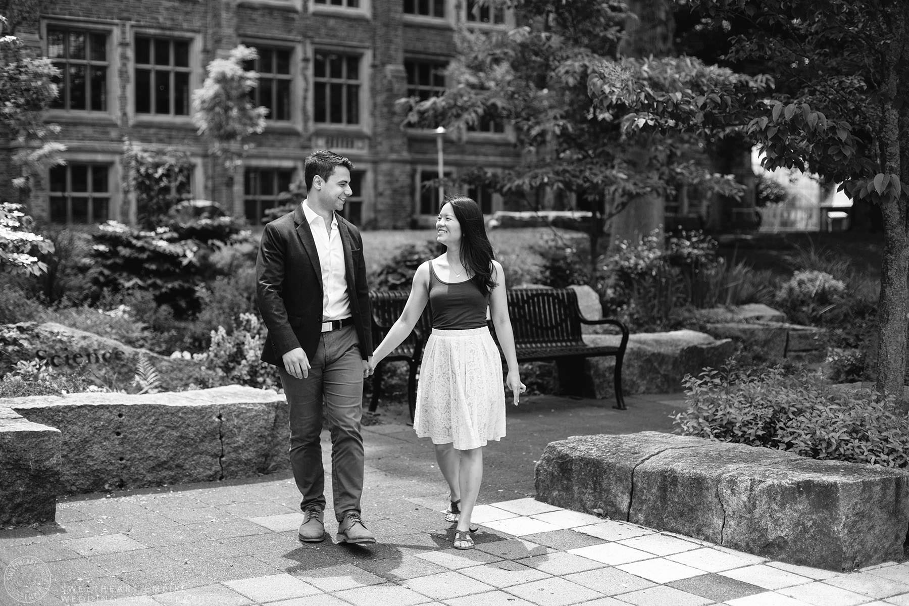 Couple walking together and holding hands, McMaster University Engagement Session