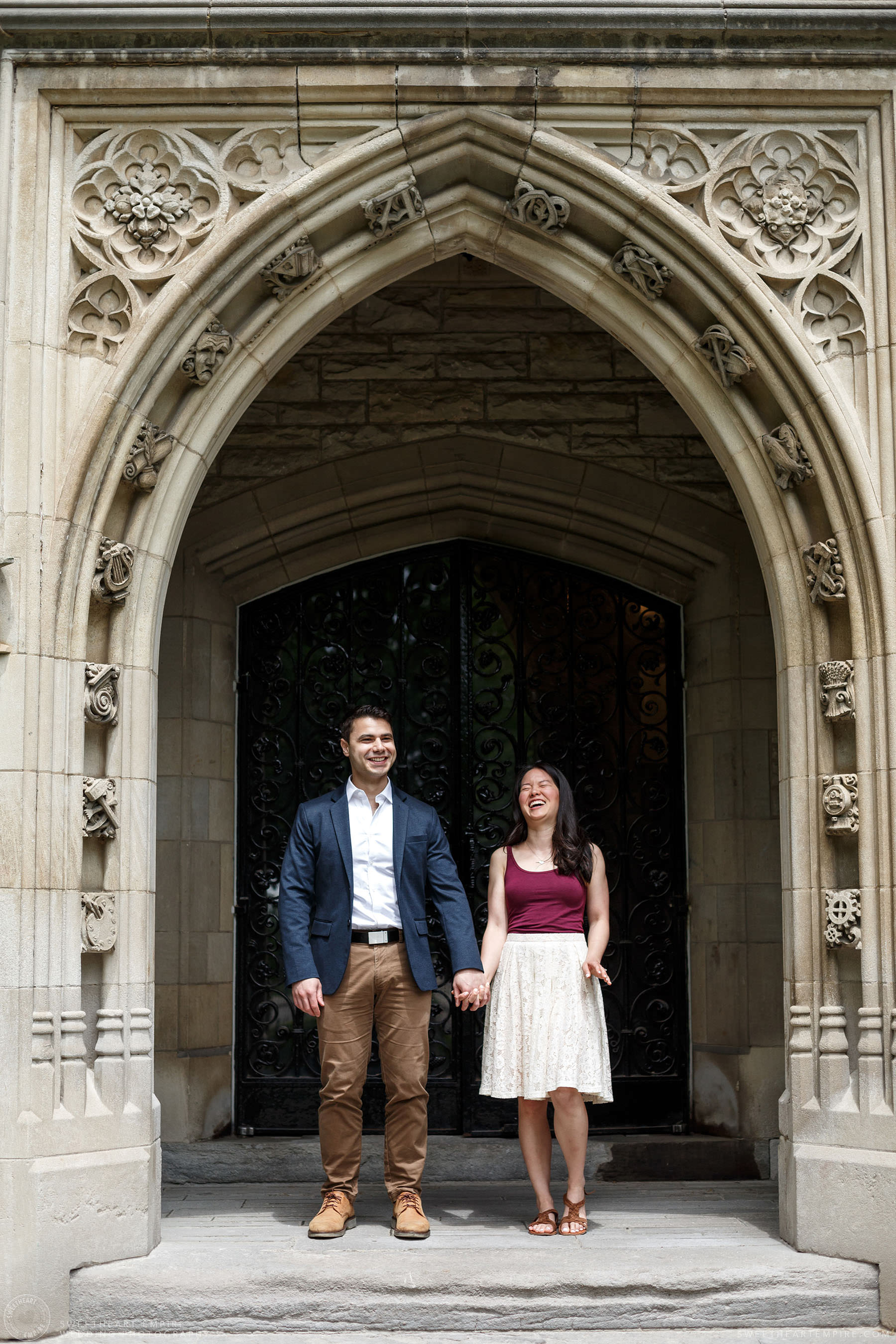 Couple holding hands and laughing together, McMaster University Engagement Session