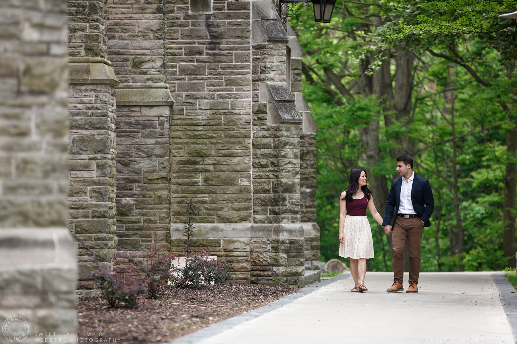 Couple walking together hand in hand, McMaster University Engagement Session
