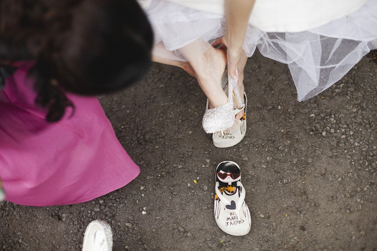 Bride slipping into her Marc Jacob's flip flops, Bayview Golf & Country Club Wedding