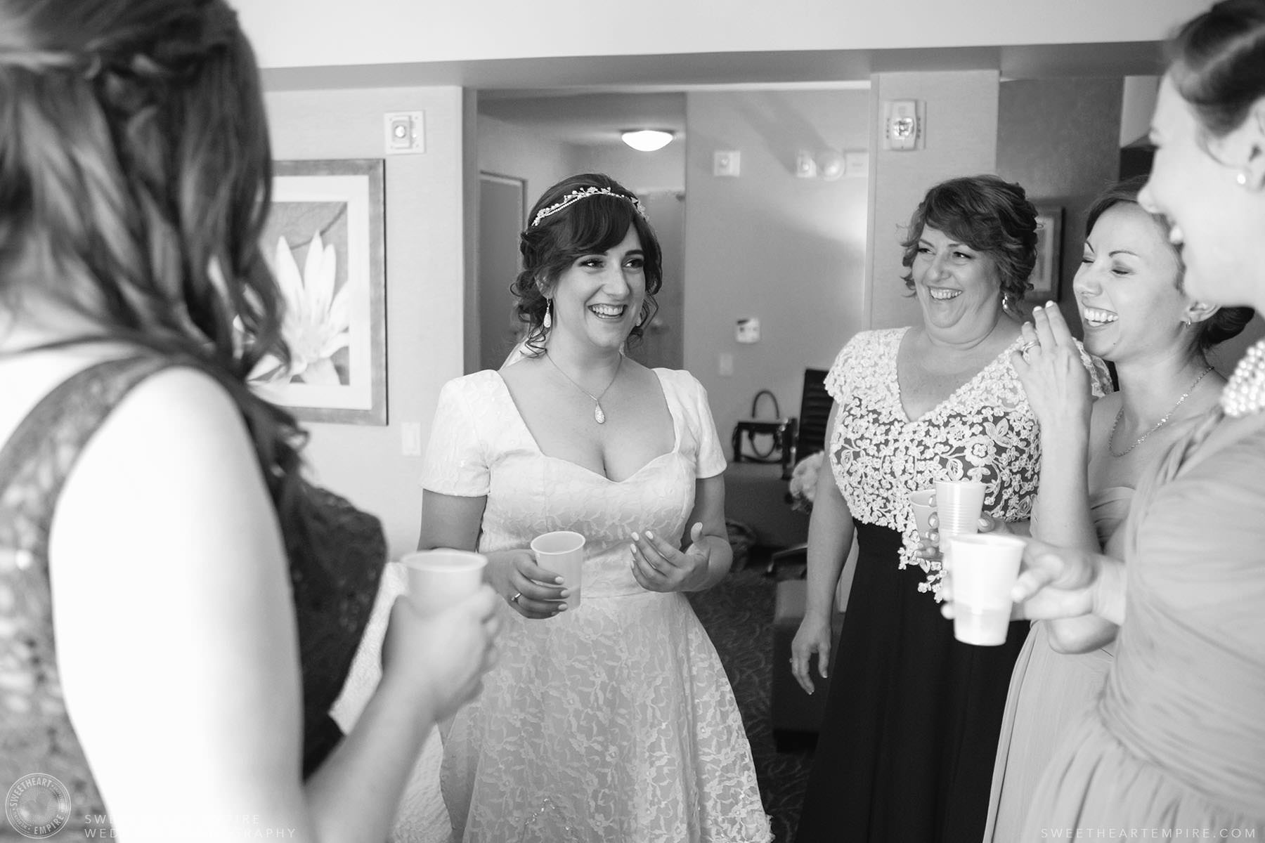 Bride sharing a laugh with her mother and bridesmaids; Aberfoyle Mill Wedding