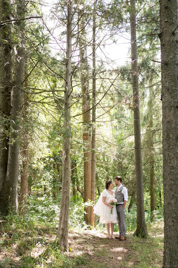 Bride and groom walking through the woods; Aberfoyle Mill Wedding