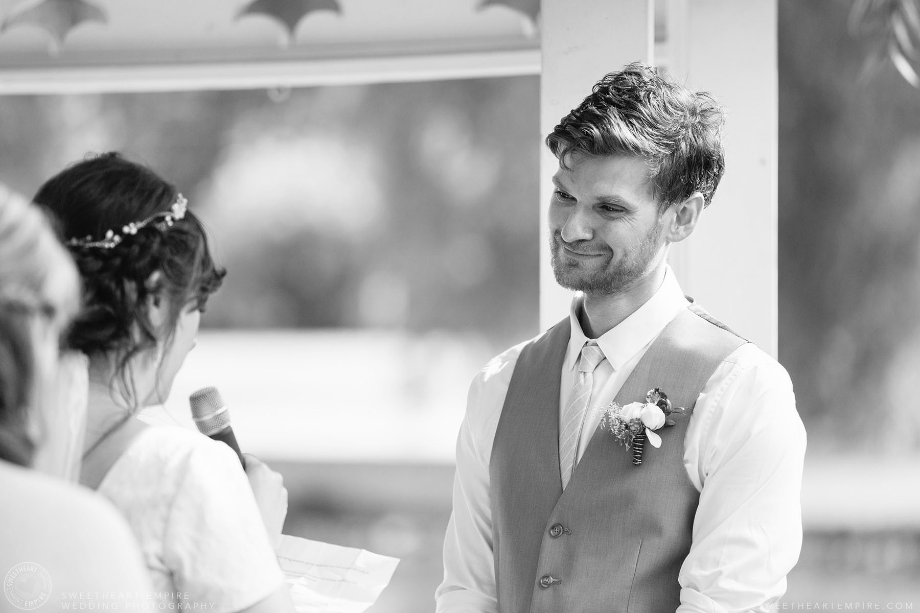 Groom looking at the bride while she says her vows; Aberfoyle Mill Wedding
