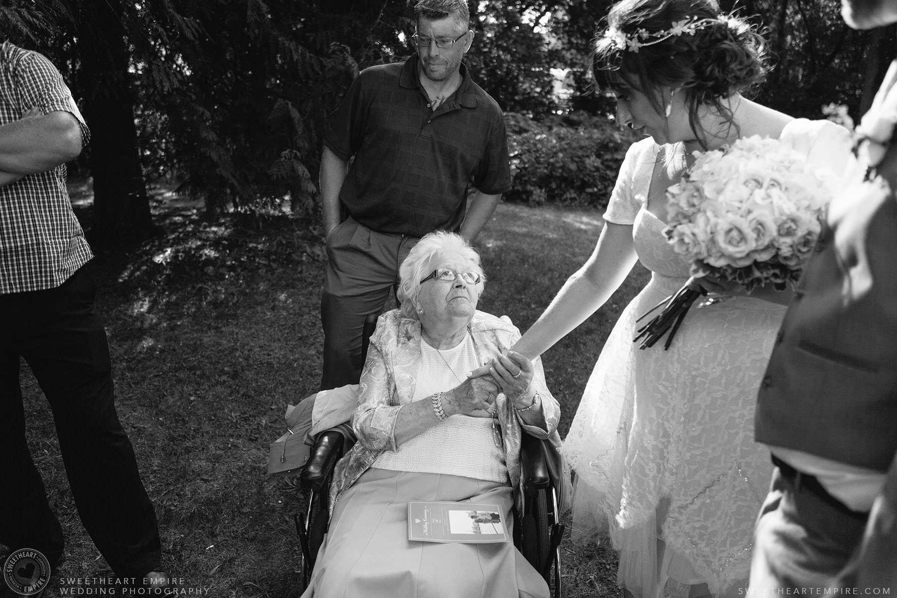 Bride greeting family members after the wedding ceremony; Aberfoyle Mill Wedding