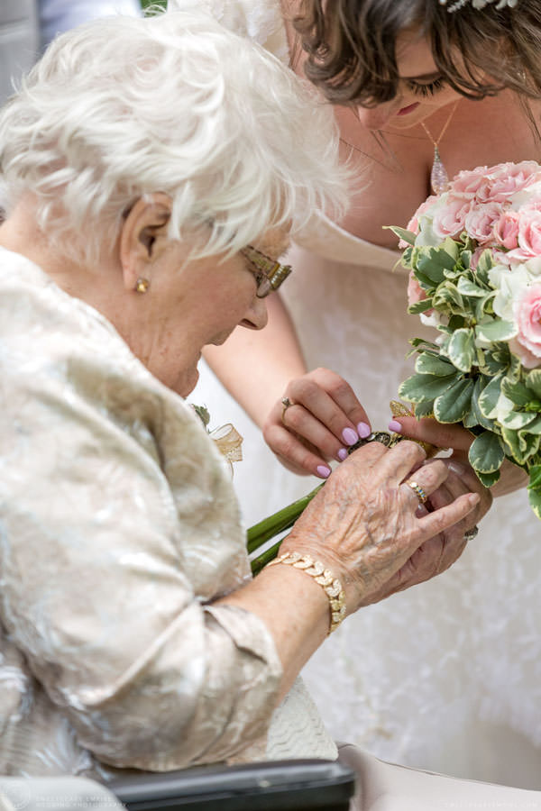 Bride showing the locket on her bouquet; Aberfoyle Mill Wedding