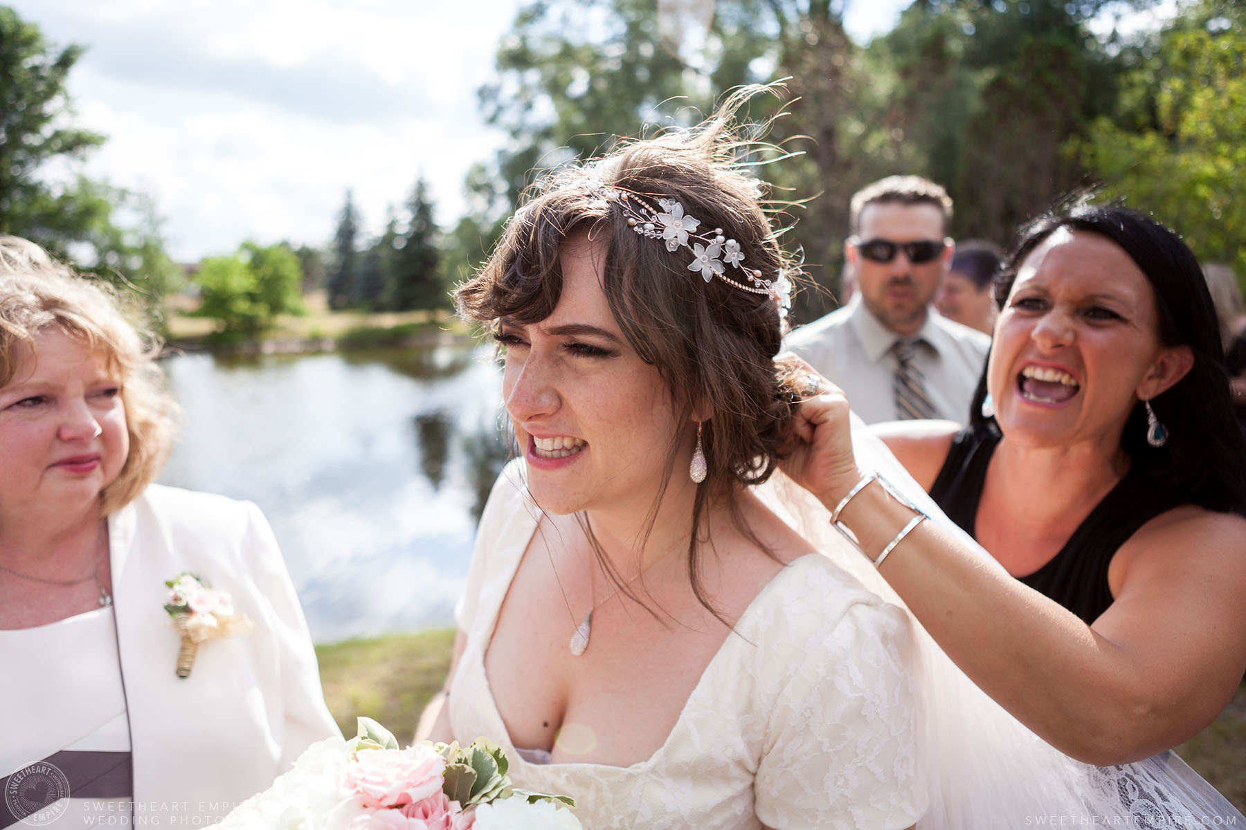 Adjusting the bride's veil; Aberfoyle Mill Wedding