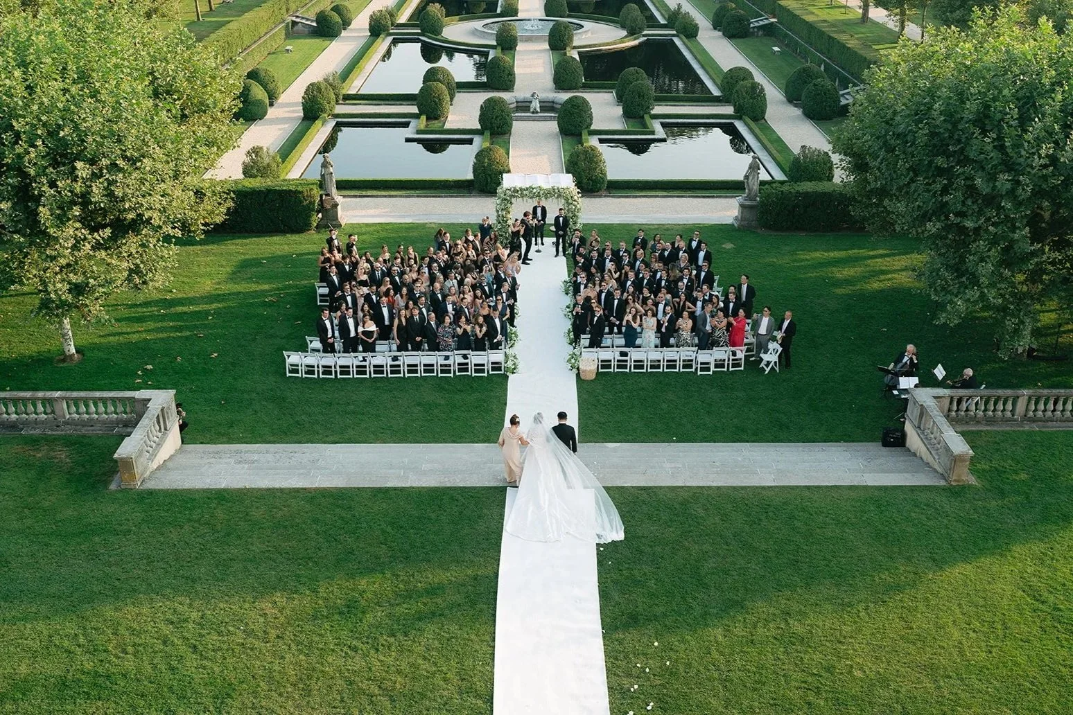 bride walking down aisle at oheka castle wedding